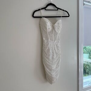 White mini dress with pearls